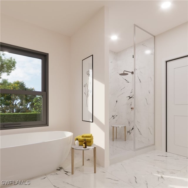 bathroom featuring shower with separate bathtub