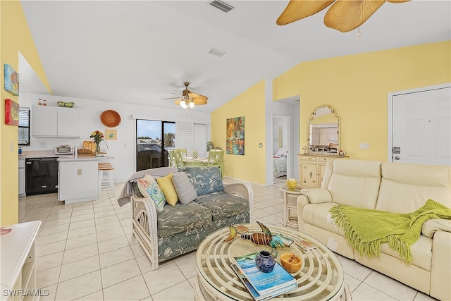 living room with lofted ceiling and light tile patterned floors