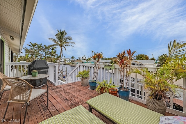 wooden deck with a water view