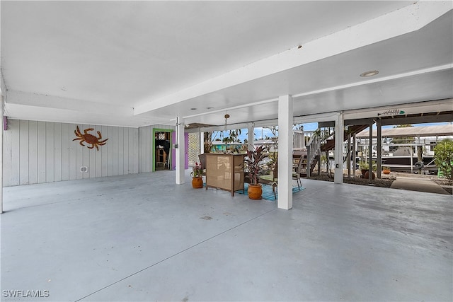 garage featuring wooden walls