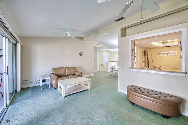 living room featuring ceiling fan, lofted ceiling, and carpet floors