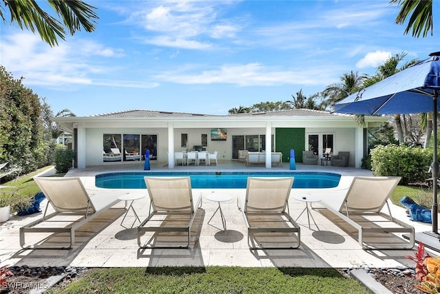 view of swimming pool with a patio area