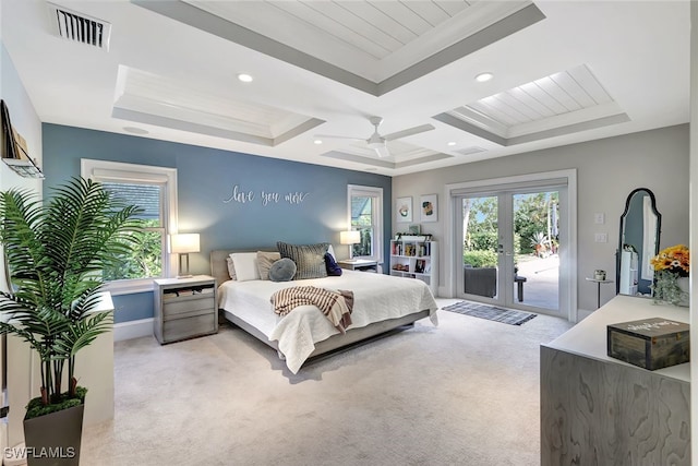 carpeted bedroom with a raised ceiling, ceiling fan, access to exterior, crown molding, and french doors