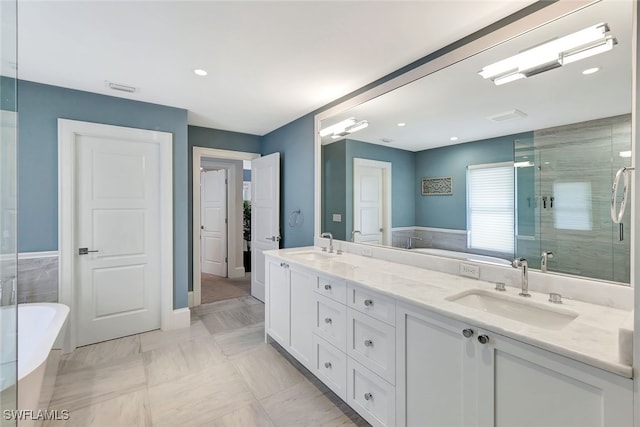 bathroom with vanity, shower with separate bathtub, and tile patterned flooring