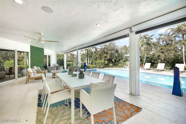 view of patio / terrace featuring ceiling fan and an outdoor living space