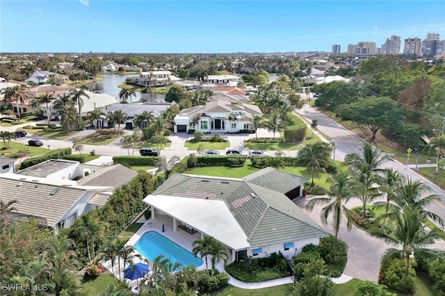 birds eye view of property with a water view