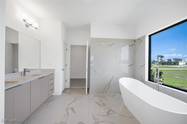 bathroom featuring a bathing tub and vanity