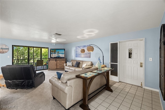 tiled living room featuring ceiling fan