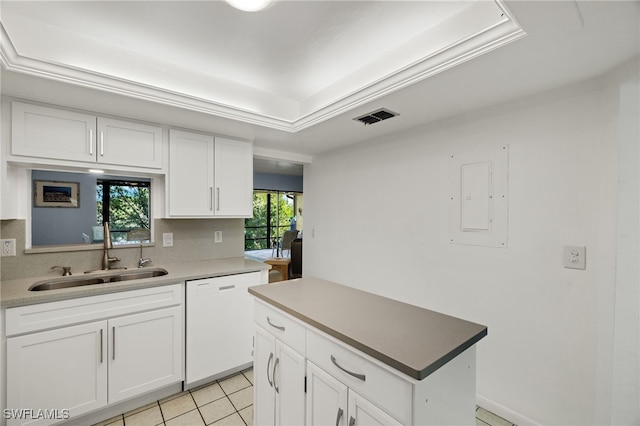 kitchen featuring sink, light tile patterned floors, white cabinetry, and dishwasher