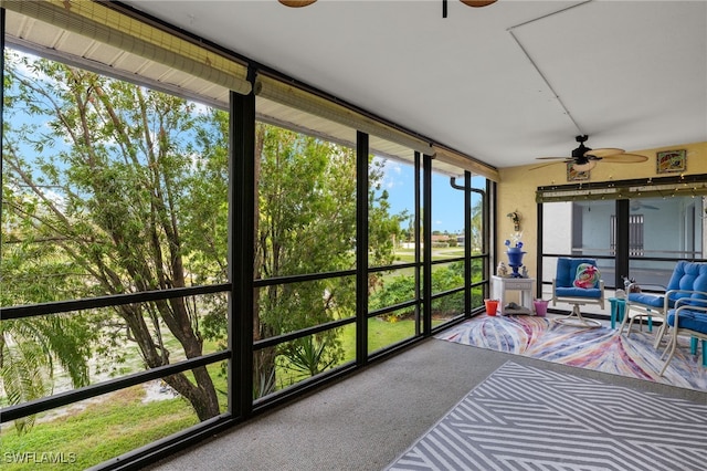 sunroom / solarium with ceiling fan and a wealth of natural light