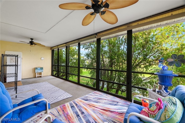 sunroom / solarium featuring ceiling fan and plenty of natural light