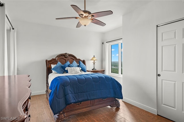 bedroom with hardwood / wood-style flooring and ceiling fan