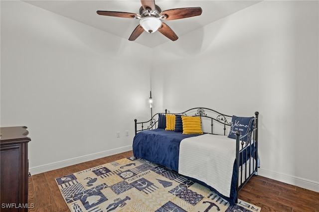 bedroom with dark wood-type flooring and ceiling fan