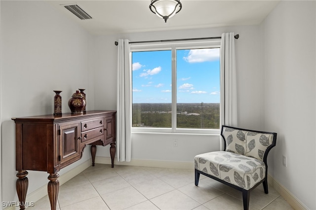 sitting room with light tile patterned floors