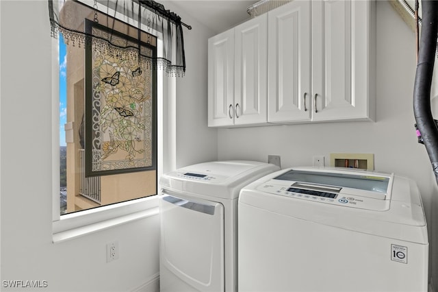 2745 1st St Unit 1906, Fort Myers, FL 33916 - laundry area featuring washer and clothes dryer and cabinet space