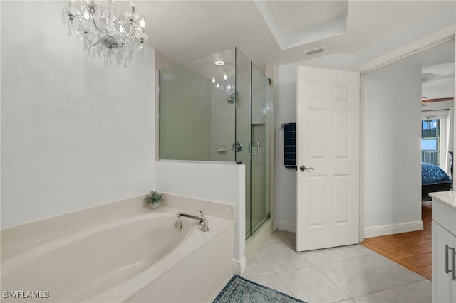 2745 1st St Unit 1906, Fort Myers, FL 33916 - full bathroom with a bath, tile patterned floors, a shower stall, vanity, and baseboards