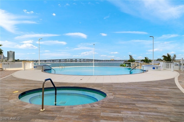 view of pool featuring a community hot tub