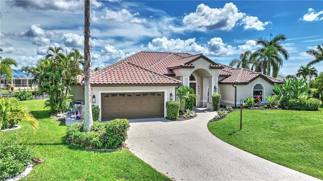 mediterranean / spanish house with a garage and a front yard