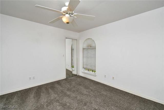 carpeted empty room with ceiling fan