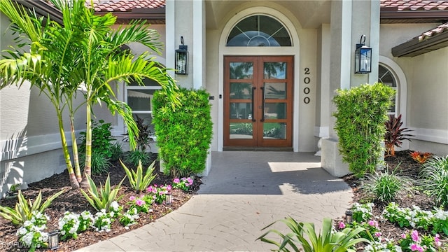 doorway to property featuring french doors