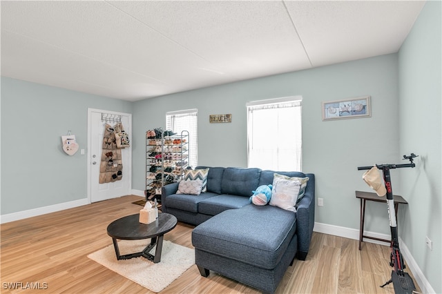 living room featuring a textured ceiling and hardwood / wood-style flooring