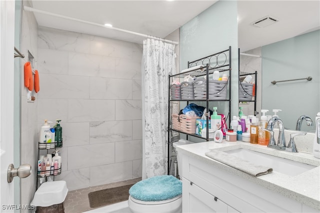 bathroom with vanity, toilet, and walk in shower