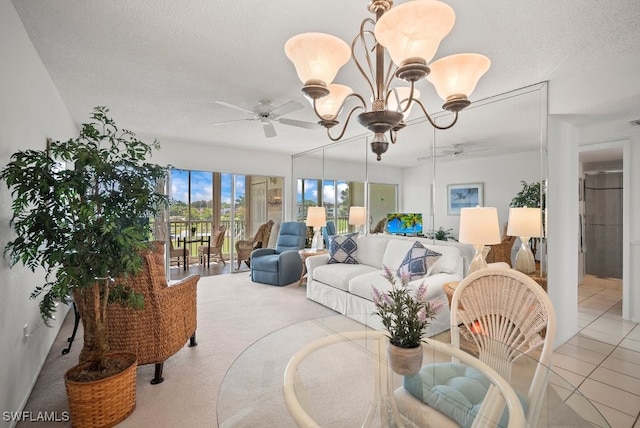 living room with light carpet, a textured ceiling, and ceiling fan with notable chandelier