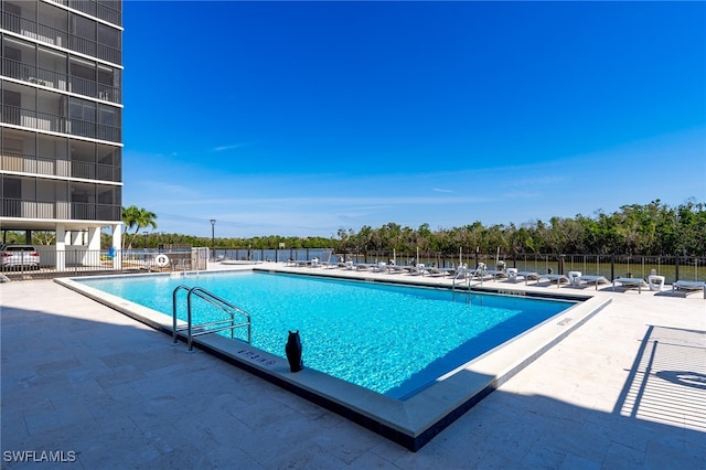 view of swimming pool with a patio area