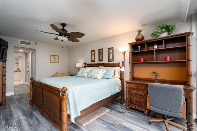 bedroom with ensuite bathroom, beam ceiling, hardwood / wood-style flooring, and ceiling fan