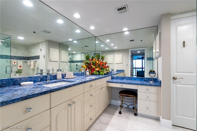 bathroom with vanity and an enclosed shower