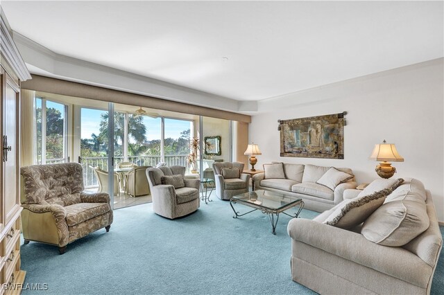 carpeted living room with ornamental molding