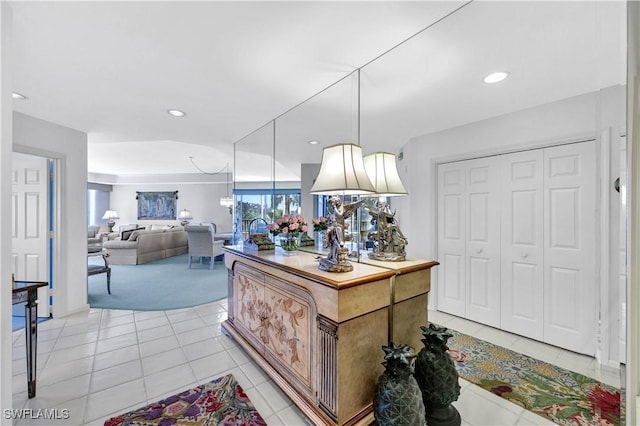 8410 Abbington Cir Unit A22, Naples, FL 34108 - kitchen with light carpet, light tile patterned flooring, recessed lighting, pendant lighting, and open floor plan
