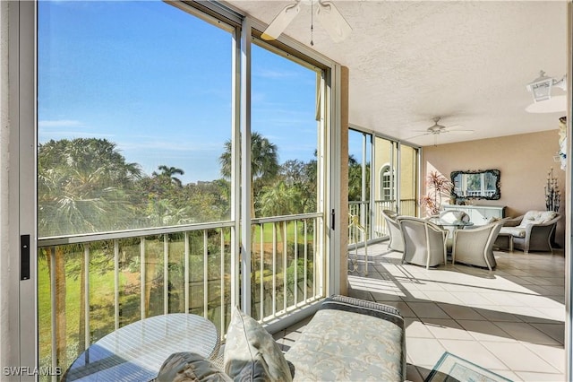 8410 Abbington Cir Unit A22, Naples, FL 34108 - sunroom / solarium with ceiling fan, outdoor dining area, tile patterned floors, a textured ceiling, and expansive windows