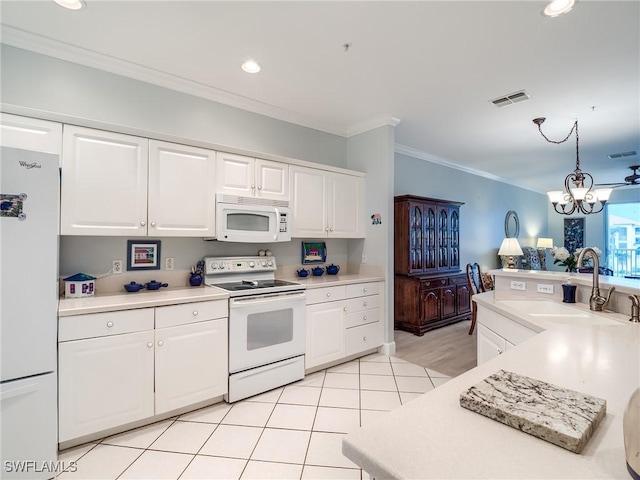 20011 Sanibel View Cir # 203, Fort Myers, FL 33908 - kitchen with white appliances, ornamental molding, light countertops, a sink, and white cabinetry