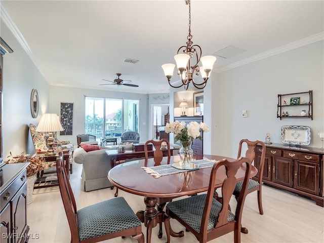 20011 Sanibel View Cir # 203, Fort Myers, FL 33908 - dining space with light wood-style floors, ornamental molding, a chandelier, and ceiling fan