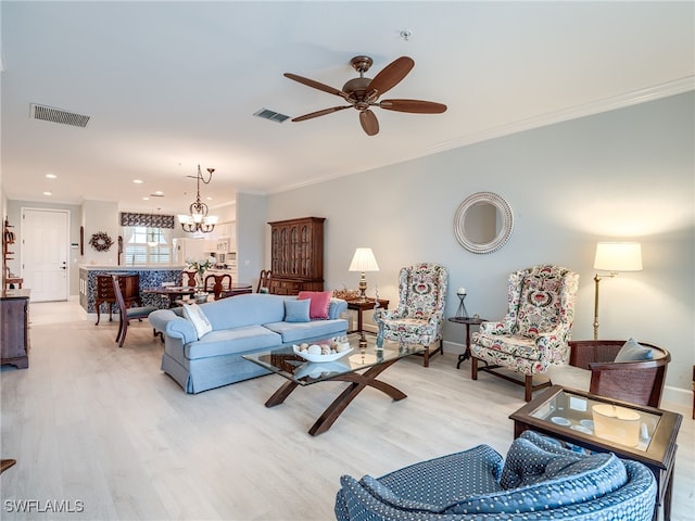 living room featuring light hardwood / wood-style floors, ceiling fan with notable chandelier, and crown molding