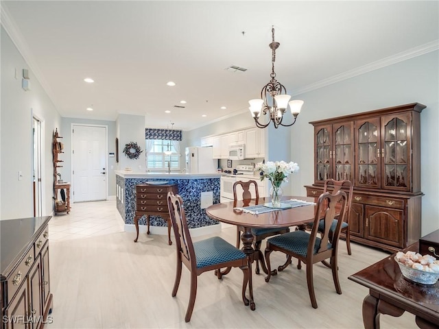 20011 Sanibel View Cir # 203, Fort Myers, FL 33908 - dining space featuring ornamental molding, a chandelier, light wood-style flooring, and recessed lighting