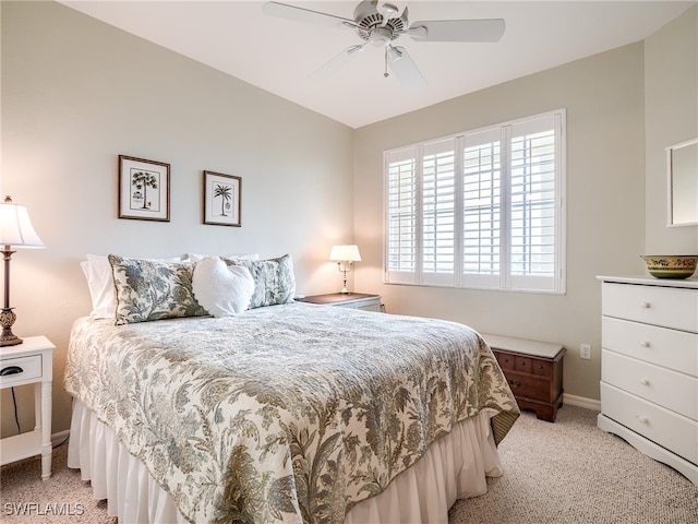 bedroom with light colored carpet and ceiling fan