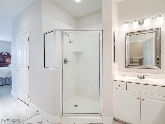 bathroom featuring vanity and an enclosed shower