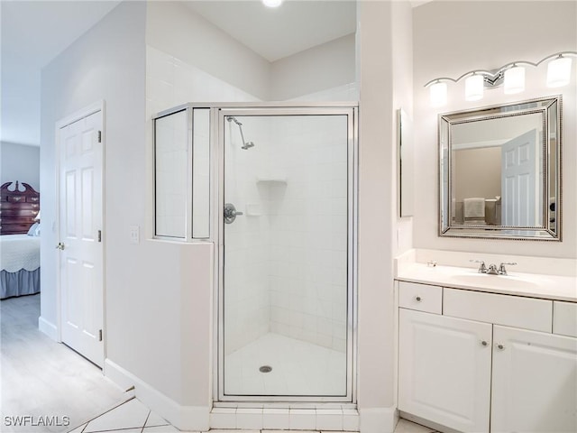 20011 Sanibel View Cir # 203, Fort Myers, FL 33908 - full bathroom featuring connected bathroom, a stall shower, vanity, and baseboards