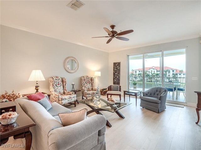 20011 Sanibel View Cir # 203, Fort Myers, FL 33908 - living area featuring ceiling fan, crown molding, light wood-style floors, and baseboards