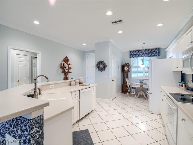 20011 Sanibel View Cir # 203, Fort Myers, FL 33908 - kitchen featuring white appliances, a sink, white cabinets, light countertops, and recessed lighting