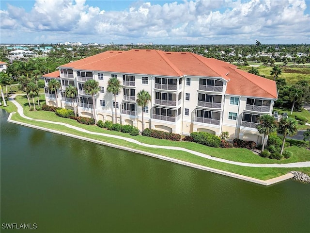 birds eye view of property featuring a water view