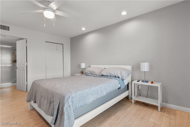 bedroom with light hardwood / wood-style flooring and ceiling fan