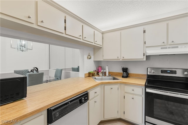 kitchen featuring sink, dishwashing machine, a textured ceiling, a notable chandelier, and electric range