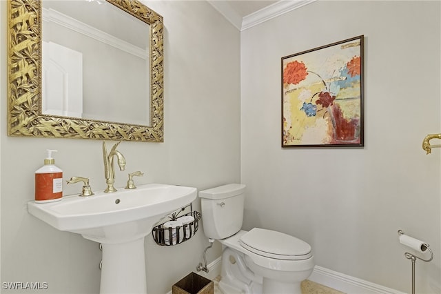 bathroom with toilet and ornamental molding