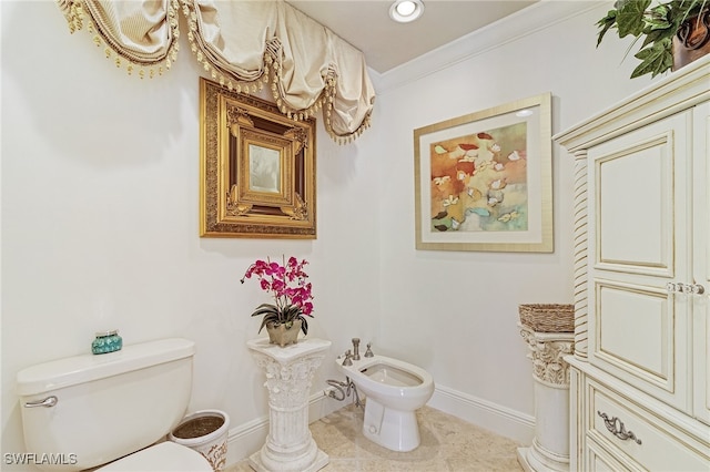 bathroom featuring tile patterned floors, toilet, crown molding, and a bidet