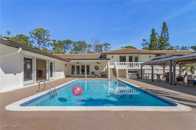 view of pool with a gazebo, a patio, and ceiling fan