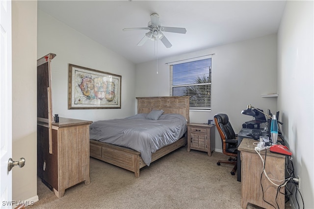 bedroom featuring light colored carpet, lofted ceiling, and ceiling fan