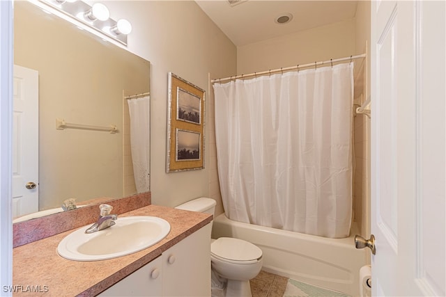 full bathroom featuring shower / bath combo, tile patterned flooring, vanity, and toilet